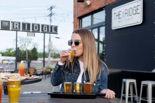 drinking a beer flight on the patio
