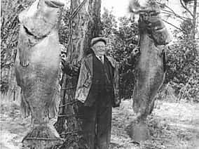 man with two large fish