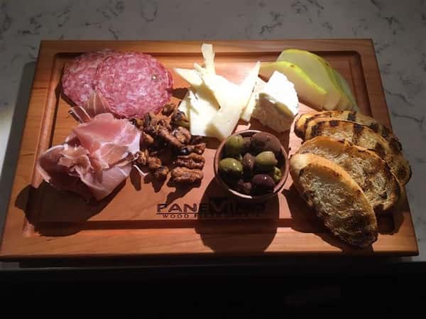 meat and cheese platter on a wooden board