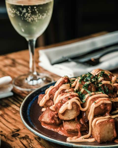 Papatas Bravas are a Spanish staple, reimagined here at El Raval