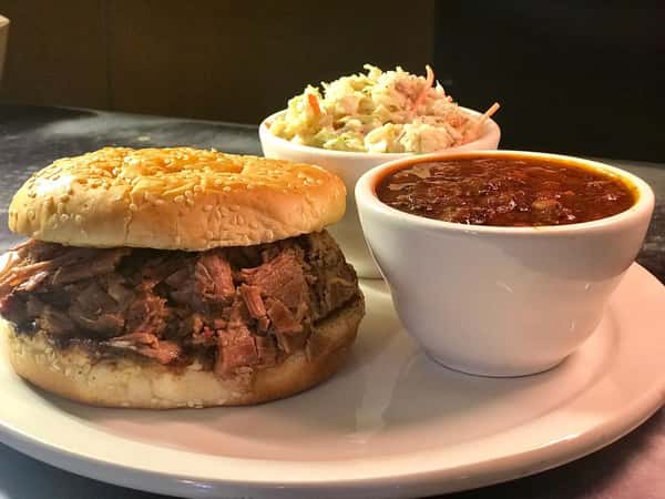 bbq sandwich with coleslaw and beans