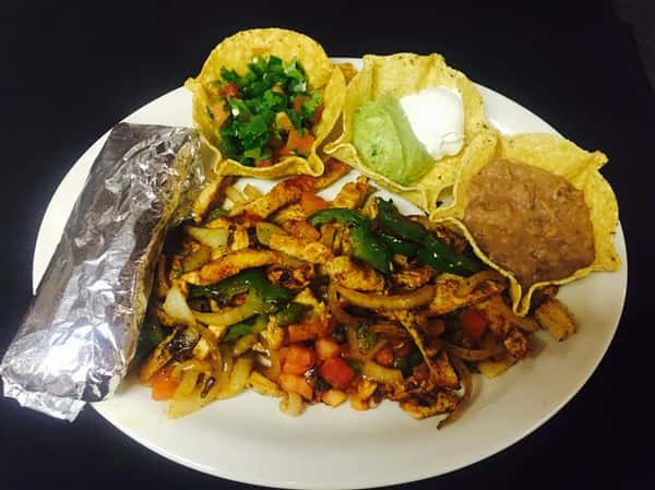 grilled vegetables served with refried beans, sour cream and guacamole