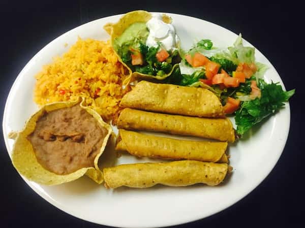 4 taquitos with a side of refried beans, rice and lettuce