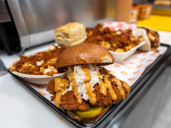 tray of chicken sandwich and sides