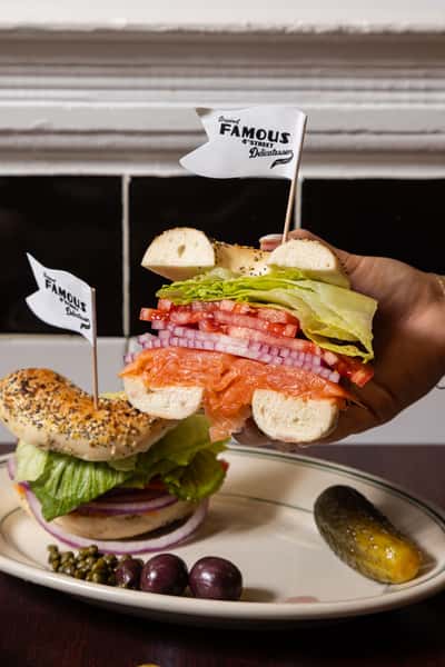 Bagel sandwich with nova lox, tomato, and onion from Famous 4th Street Delicatessen — kosher-style deli classic in Philadelphia.