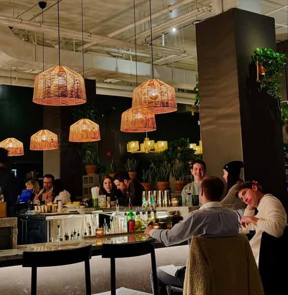 Elegant and upscale restaurant interior with soft lighting and customers