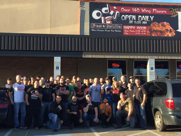 staff standing outside of the restaurant exterior