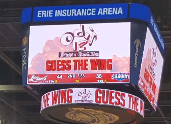 store logo and "guess the wing" shown on a scoreboard