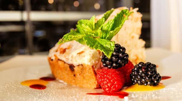 Dessert with fresh raspberries, blackberries and mint