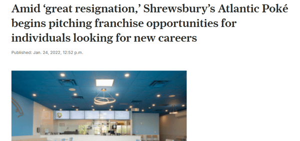 Atlantic Poké is pitching franchise opportunities for people seeking new careers. The interior of a Poké restaurant is brightly lit with a blue ceiling and white walls.
