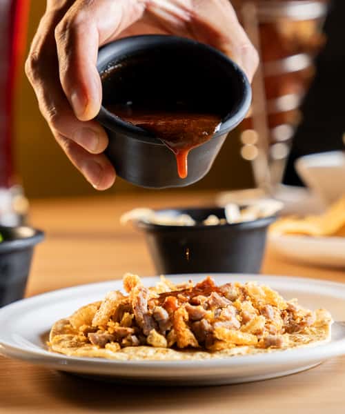 Sauce being poured on food