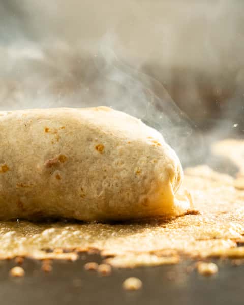 Food being cooked on a griddle