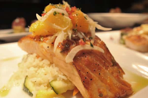 fish dish over rice on a plate