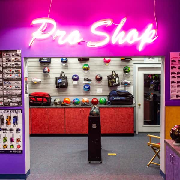 pro shop entrance with neon "pro shop" sign