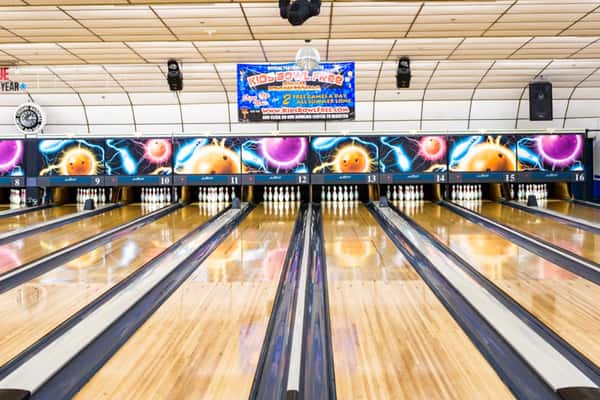bowling lanes set with bowling pins