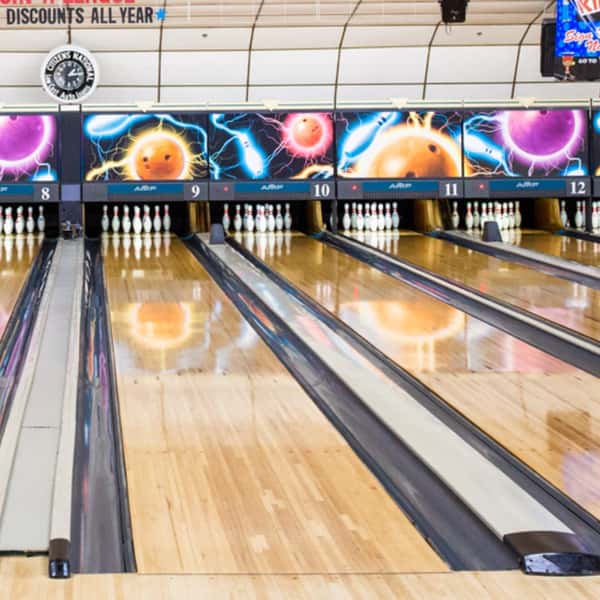 bowling lanes set with bowling pins
