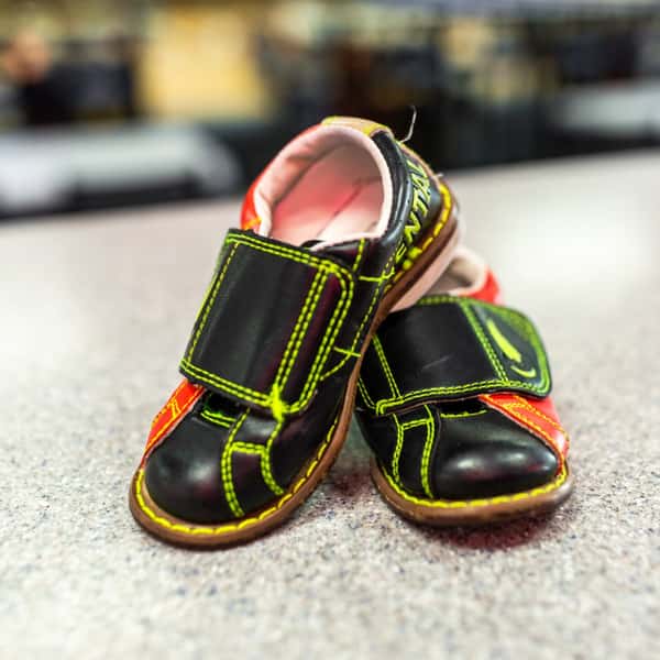 kids bowling shoes on the counter