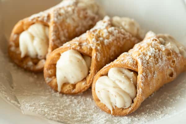 Cannoli Covered with Powdered Sugar