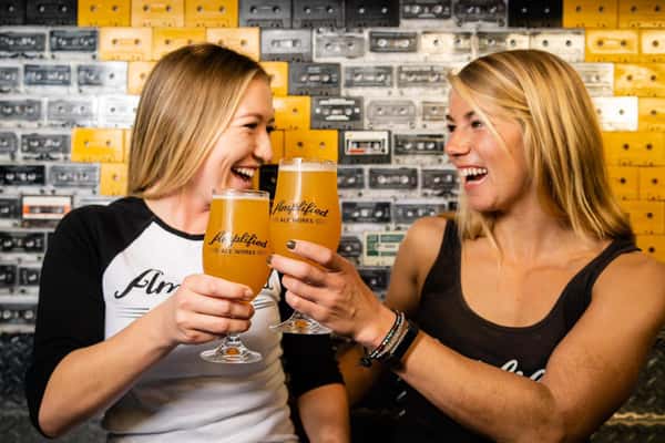 girls smiling with beer