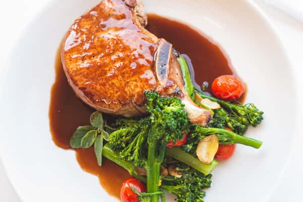 Saucy meat dish with a side of salad