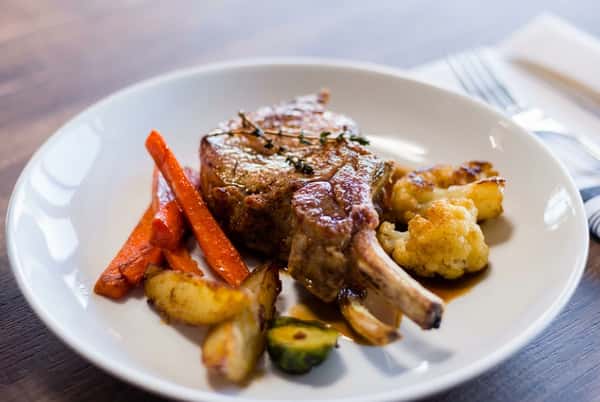Shank with potatoes and sliced carrots