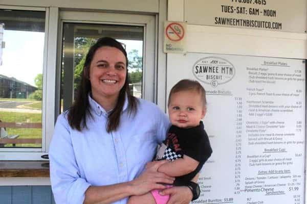Brandy White holding daughter Lennon at Sawnee Mountain Biscuit Co