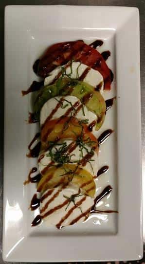 Chef specialty dish drizzled with sauce
