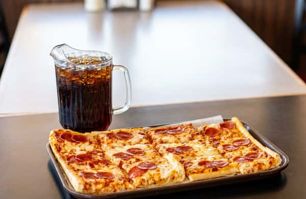 Square pizza with a drink