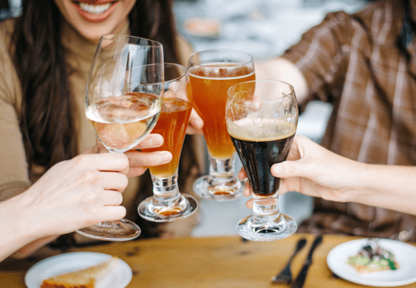 Guests holding glasses of beer