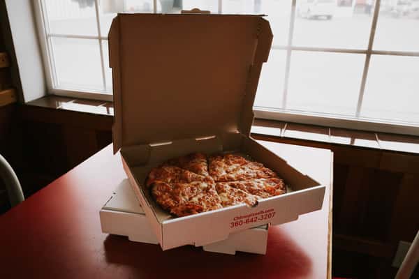 Pizza in carryout boxes
