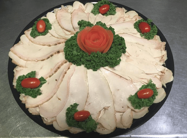 Sliced turkey breast on party tray