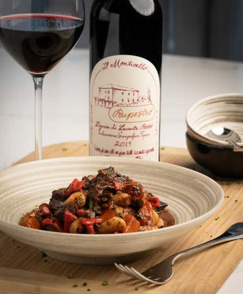 A wine dinner course at 360 Bistro — lamb ragout paired with Il Monticello