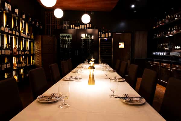 The Wine Room at 360 Bistro set with linens for an evening private dinner