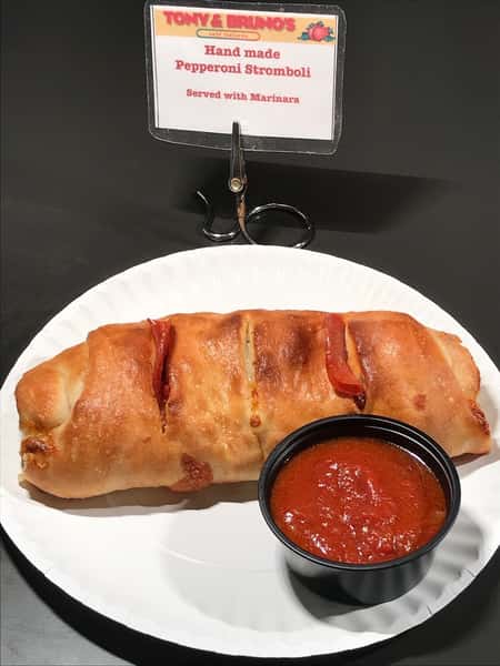 pepperoni stromboli with a side of sauce