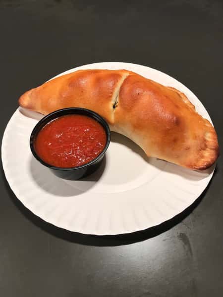 calzone with a side of sauce