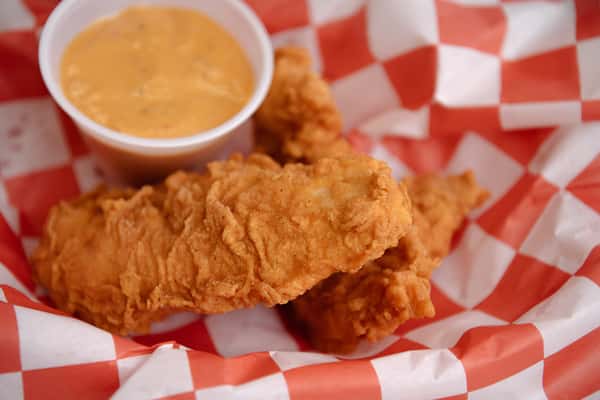 Hand breaded chicken tenders served with dipping sauce.
