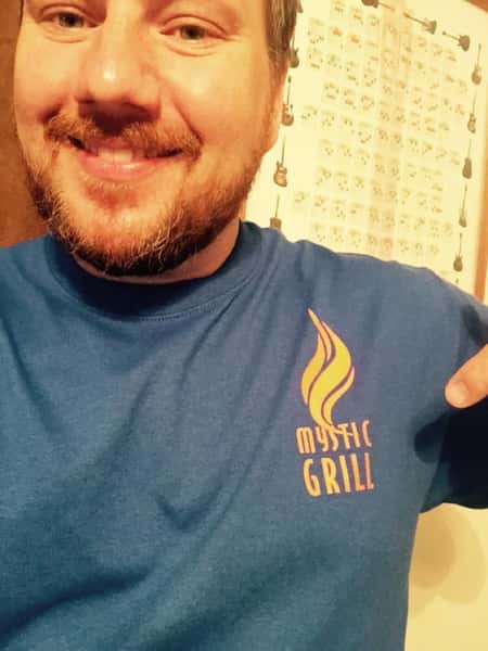 Guy with Mystic Grill shirt