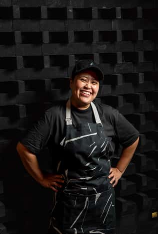 Smiling team member in an apron