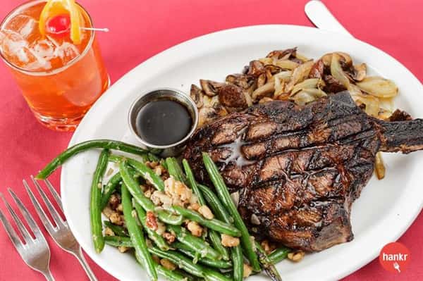 Grilled Steak served with au jus, fried onions and green beans
