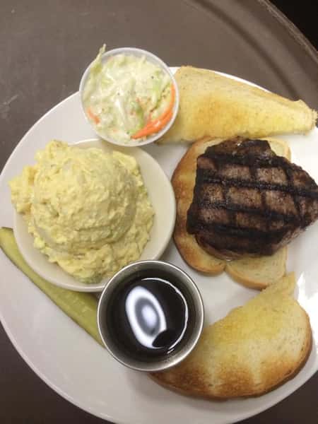 Grilled steak on toasted bread, served with puree and a side dressing