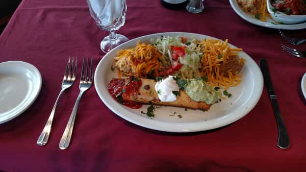 fried enchilada with rice, beans and cheese