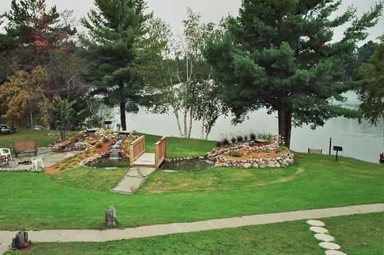 Outdoor photo of the yard with a walkway and bridge