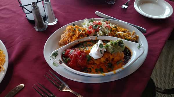 mexican dish with sauce and cheese