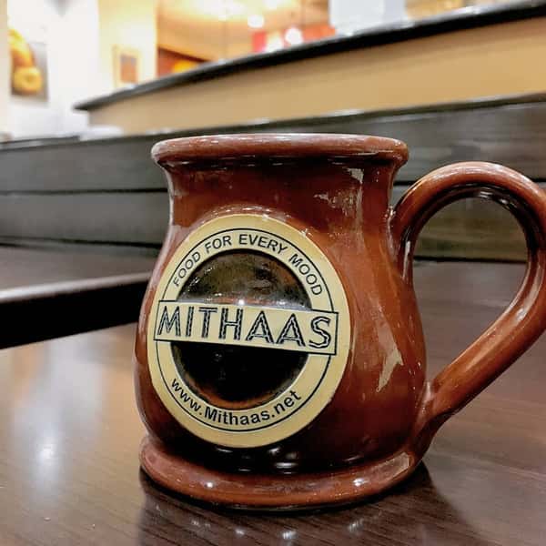 mithaas coffee mug on a table