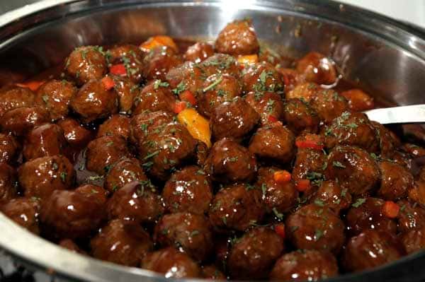 catering displaying of meatballs with sauce and herbs