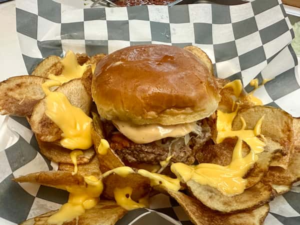Burger with crispy potato slices with cheese