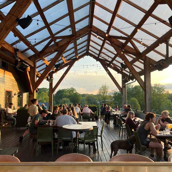 people enjoying dinner on a deck
