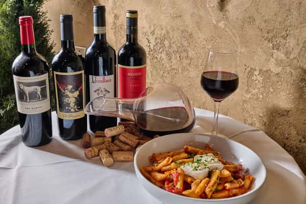 table of wine and pasta