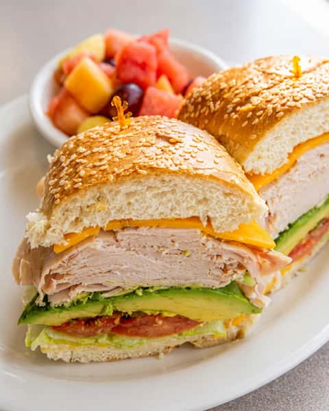 Turkey Bacon Avocado Cheddar on a French Roll with Fresh Fruit