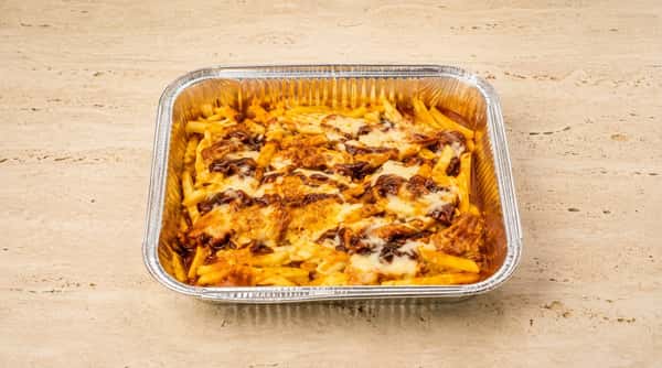 Baked pasta topped with melted cheese and sauce in a takeaway tray from Ciao Bella